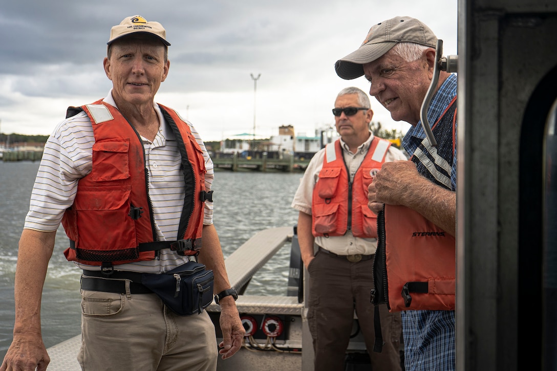 Multiagency shoreline protection partners navigate the Chesapeake Bay during a coastal resiliency project tour as part of ongoing monitoring of Martin Island and surrounding Smith Island communities near Rhodes Point, Somerset County, Md., Oct. 7, 2021. The practical implementation of an integrated approach to flood and coastal flood hazard mitigation relies on a collaborative, shared responsibility framework between Federal, state, and local agencies and the public. (U.S. Army photo by Greg Nash)