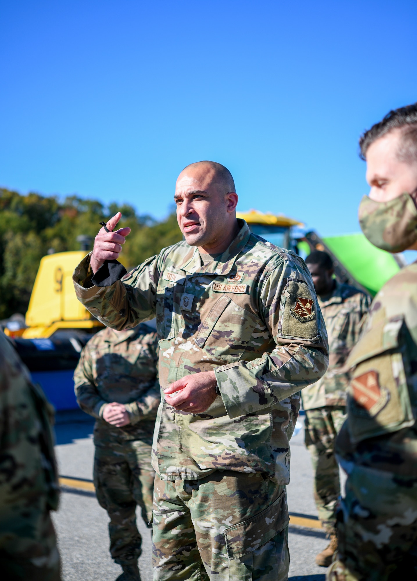 Master Sgt. Joshua Toth, 316th Civil Engineer Squadron pavement and equipment section chief, speaks to Joint Base Andrews leadership outside as he showcases the various vehicles and equipment meant for snow control during the “All Things Snow" event at JBA, Md., Nov. 1, 2021.
