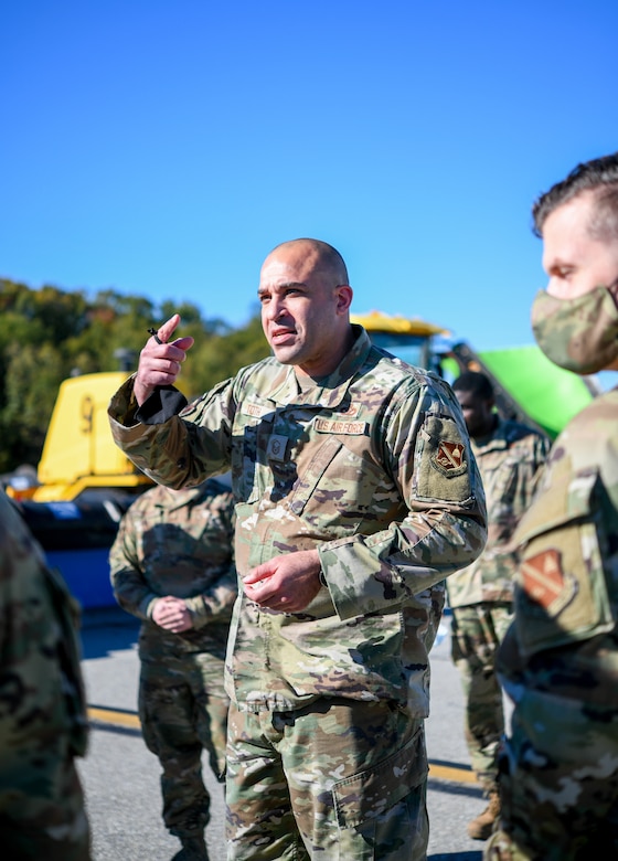 Master Sgt. Joshua Toth, 316th Civil Engineer Squadron pavement and equipment section chief, speaks to Joint Base Andrews leadership outside as he showcases the various vehicles and equipment meant for snow control during the “All Things Snow" event at JBA, Md., Nov. 1, 2021.