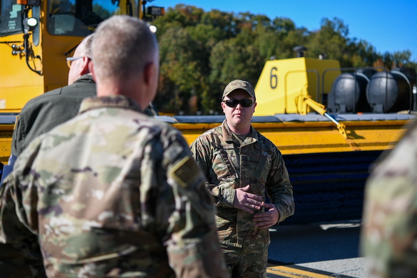 Senior Airman Hunter Tysinger, 316th Civil Engineer Squadron pavements and equipment journeyman, briefs about proper snow equipment usage to Col. Tyler Schaff, 316th Wing and Joint Base Andrews commander, and other JBA senior leadership during the “All Things Snow" event at JBA, Md., Nov. 1, 2021.