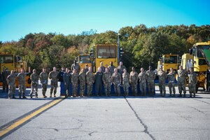 Joint Base Andrews senior leadership poses for a photo on the flight line during the “All Things Snow" event at JBA, Md., Nov. 1, 2021.
