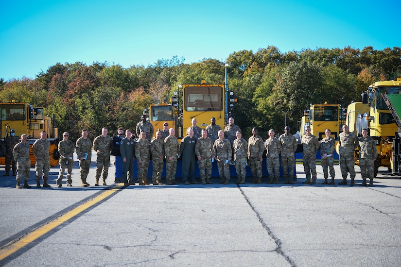 Joint Base Andrews senior leadership poses for a photo on the flight line during the “All Things Snow" event at JBA, Md., Nov. 1, 2021.