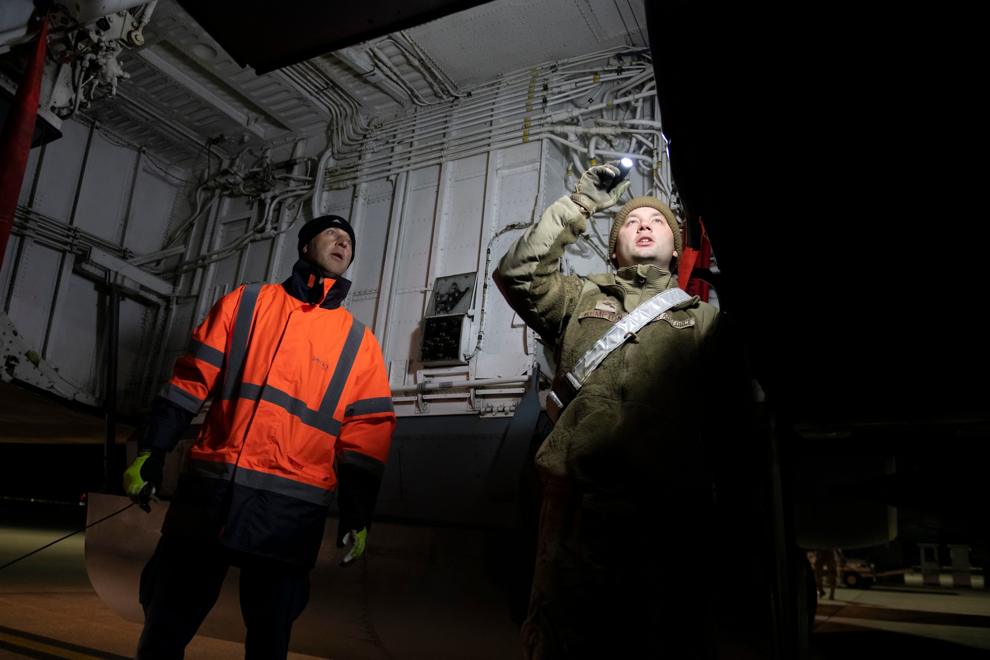 U.S. Air Force Senior Airman Jake Kempton, right, 100th Aircraft Maintenance Squadron crew chief, and Kev Huxtable, left, Royal Air Force Brize Norton contractor, conduct post-flight inspection of a KC-135 Stratotanker at RAF Brize Norton, England, Nov. 2, 2021. Airmen from the 100th Air Refueling Wing conducted operations out of RAFF as part of an Agile Combat Employment exercise. The operations taking place at Fairford provide a dynamic and partnership-focused training environment which ensures U.S. forces remain postured to deliver airpower across the European theater while strengthening interoperability with our NATO allies. (U.S. Air Force photo by Senior Airman Jennifer Zima)