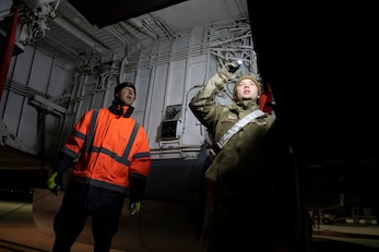 U.S. Air Force Senior Airman Jake Kempton, right, 100th Aircraft Maintenance Squadron crew chief, and Kev Huxtable, left, Royal Air Force Brize Norton contractor, conduct post-flight inspection of a KC-135 Stratotanker at RAF Brize Norton, England, Nov. 2, 2021. Airmen from the 100th Air Refueling Wing conducted operations out of RAFF as part of an Agile Combat Employment exercise. The operations taking place at Fairford provide a dynamic and partnership-focused training environment which ensures U.S. forces remain postured to deliver airpower across the European theater while strengthening interoperability with our NATO allies. (U.S. Air Force photo by Senior Airman Jennifer Zima)