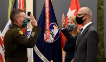 Lt. Gen. Daniel Karbler, commanding general, U.S. Army Space and Missile Defense Command, issues the oath of office to Dr. Neset Akӧzbek, senior research scientist in SMDC's Technical Center, during his senior scientific professional appointment ceremony at the command's Redstone Arsenal, Alabama, headquarters, Oct. 19. (U.S. Army photo by Carrie David Campbell)