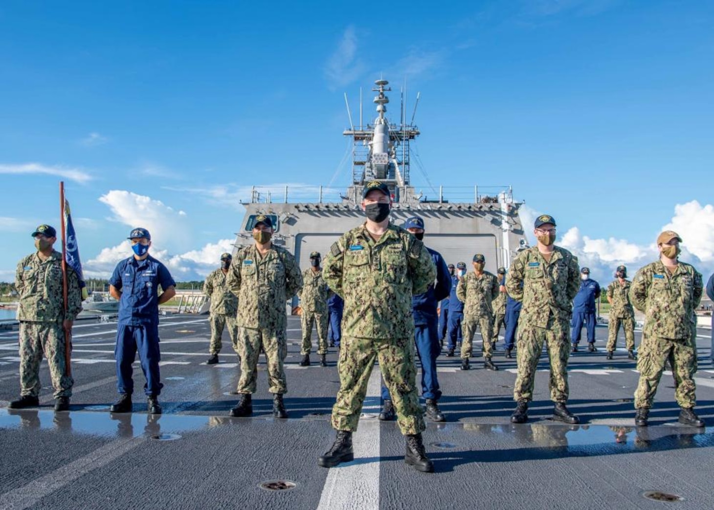 U.S. Navy Sailors and U.S. Coast Guardsman Observe Morning Colors