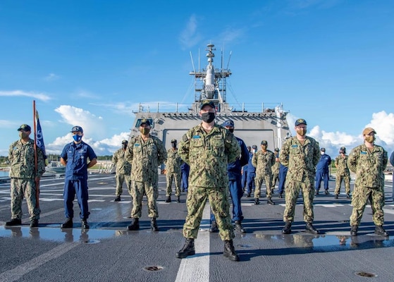 U.S. Navy Sailors and U.S. Coast Guardsman Observe Morning Colors