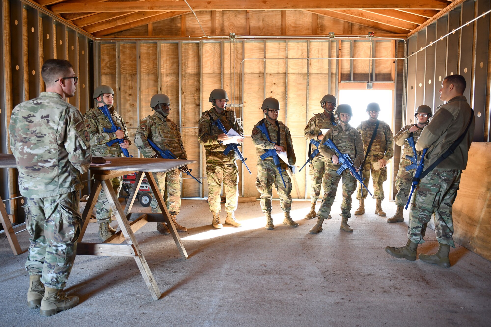 Group of Airmen gather during a training exercise at Altus AFB.