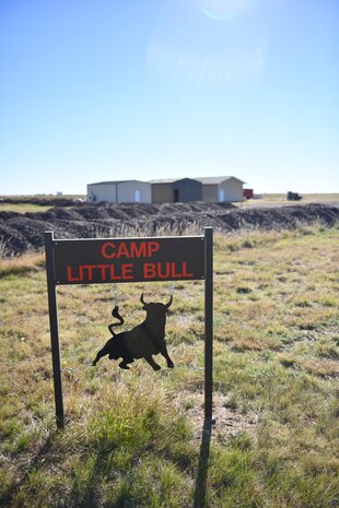 A sign marked "Camp Little Bull" marks the entrance to a recently constructed training area.
