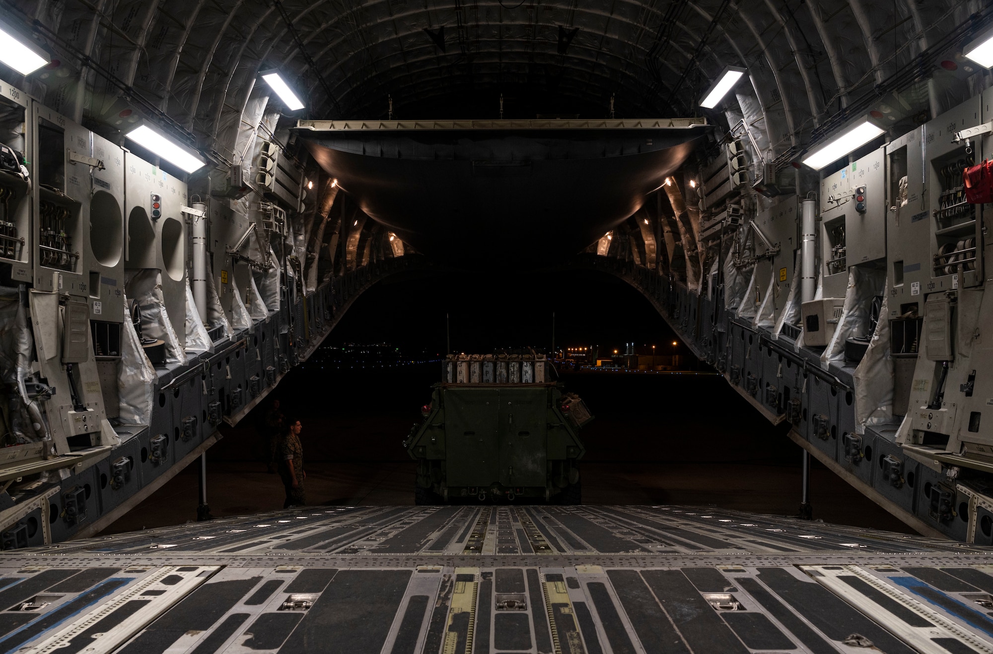 A Light Armored Vehicle, assigned to the III Marine Expeditionary Force, is loaded onto a C-17 Globemaster III during Exercise Rainier War 21B at Marine Corps Air Station Futenma, Japan, Nov. 4, 2021. Rainier War 21B exercised and evaluated the 62nd Airlift Wing’s ability to employ the force and their ability to perform during wartime and contingency taskings in a high-intensity, wartime contested, degraded and operationally limited environment while supporting the contingency operations against a near-peer adversary in the U.S. Indo-Pacific Command area of responsibility. (U.S. Air Force photo by Staff Sgt. Rachel Williams)