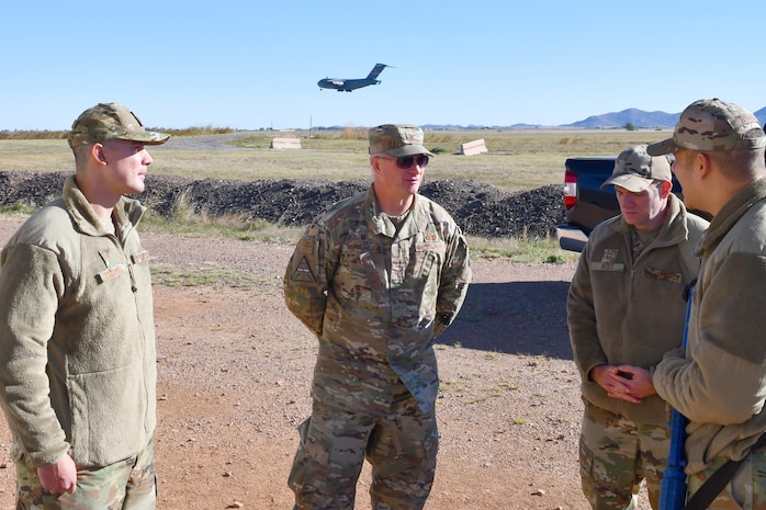 Air Force Master Sergeant briefs Air Force Colonel and Major.