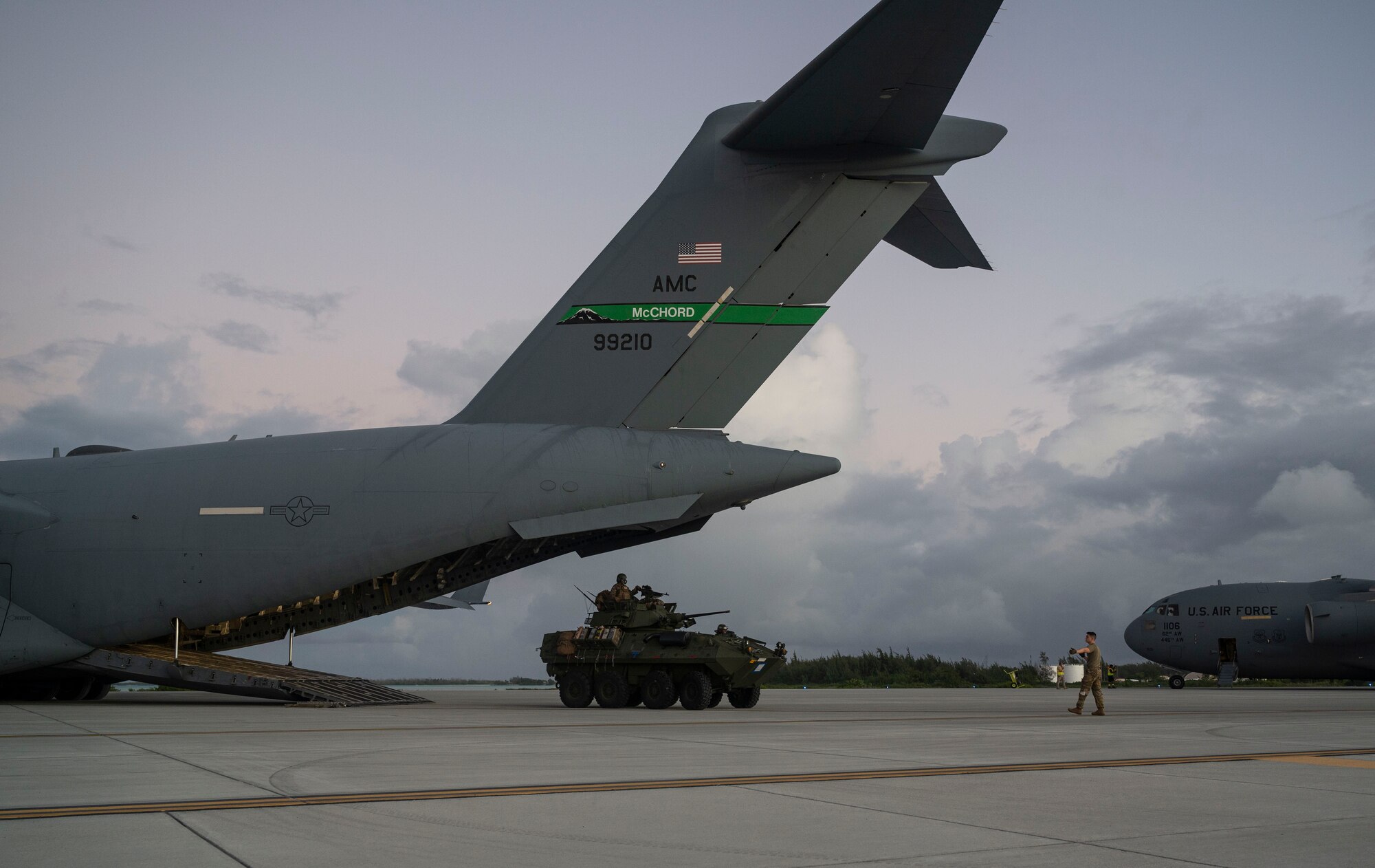 A Light Armored Vehicle, assigned to III Marine Expeditionary Force, exits  a C-17 Globemaster III at Wake Island during Exercise Rainier War 21B, Nov. 5, 2021. Rainier War 21B exercised and evaluated the 62nd Airlift Wing’s ability to employ the force and their ability to perform during wartime and contingency taskings in a high-intensity, wartime contested, degraded and operationally limited environment while supporting the contingency operations against a near-peer adversary in the U.S. Indo-Pacific Command area of responsibility. (U.S. Air Force photo by Staff Sgt. Rachel Williams)