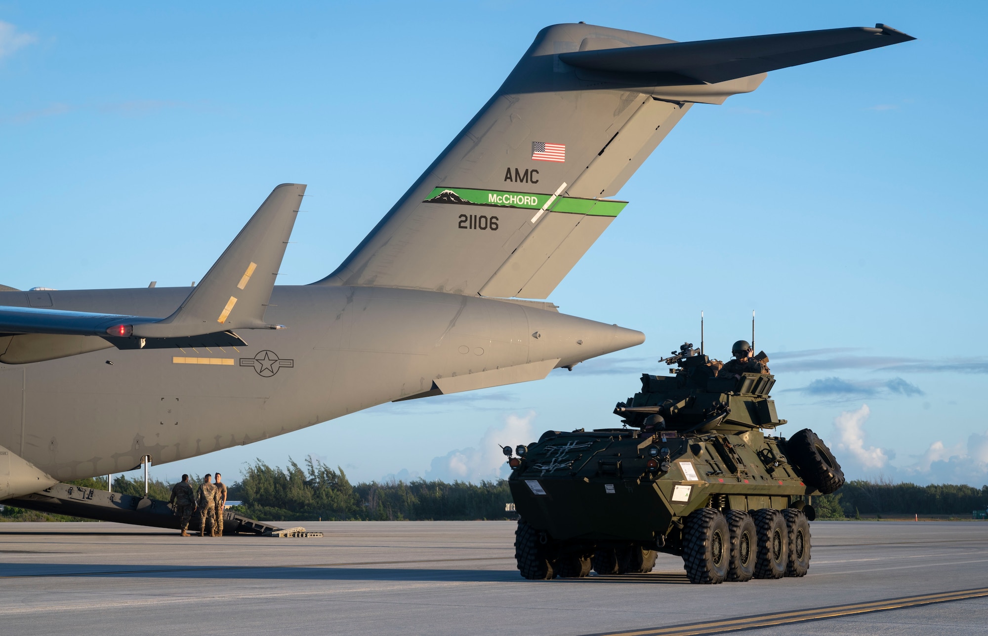 A Light Armored Vehicle, assigned to III Marine Expeditionary Force, exits  a C-17 Globemaster III at Wake Island during Exercise Rainier War 21B, Nov. 5, 2021. Rainier War 21B exercised and evaluated the 62nd Airlift Wing’s ability to employ the force and their ability to perform during wartime and contingency taskings in a high-intensity, wartime contested, degraded and operationally limited environment while supporting the contingency operations against a near-peer adversary in the U.S. Indo-Pacific Command area of responsibility. (U.S. Air Force photo by Staff Sgt. Rachel Williams)
