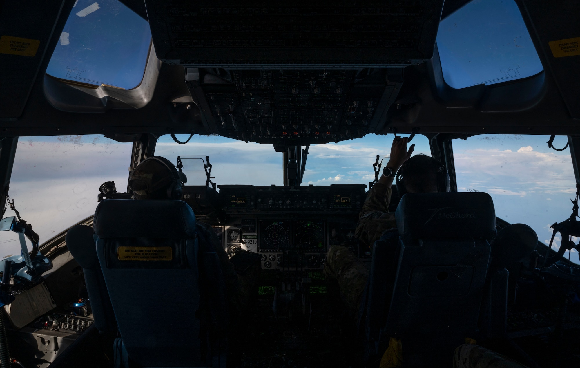 U.S. Air Force 1st Lt. Dylan Bishop, left, a co-pilot with the 7th Airlift Squadron, and U.S. Air Force Maj. John Greenway, a pilot with the 7th AS, fly a C-17 Globemaster III over the Pacific Ocean during Exercise Rainier War 21B, Nov. 5, 2021. Rainier War 21B exercised and evaluated the 62nd Airlift Wing’s ability to employ the force and their ability to perform during wartime and contingency taskings in a high-intensity, wartime contested, degraded and operationally limited environment while supporting the contingency operations against a near-peer adversary in the U.S. Indo-Pacific Command area of responsibility. (U.S. Air Force photo by Staff Sgt. Rachel Williams)