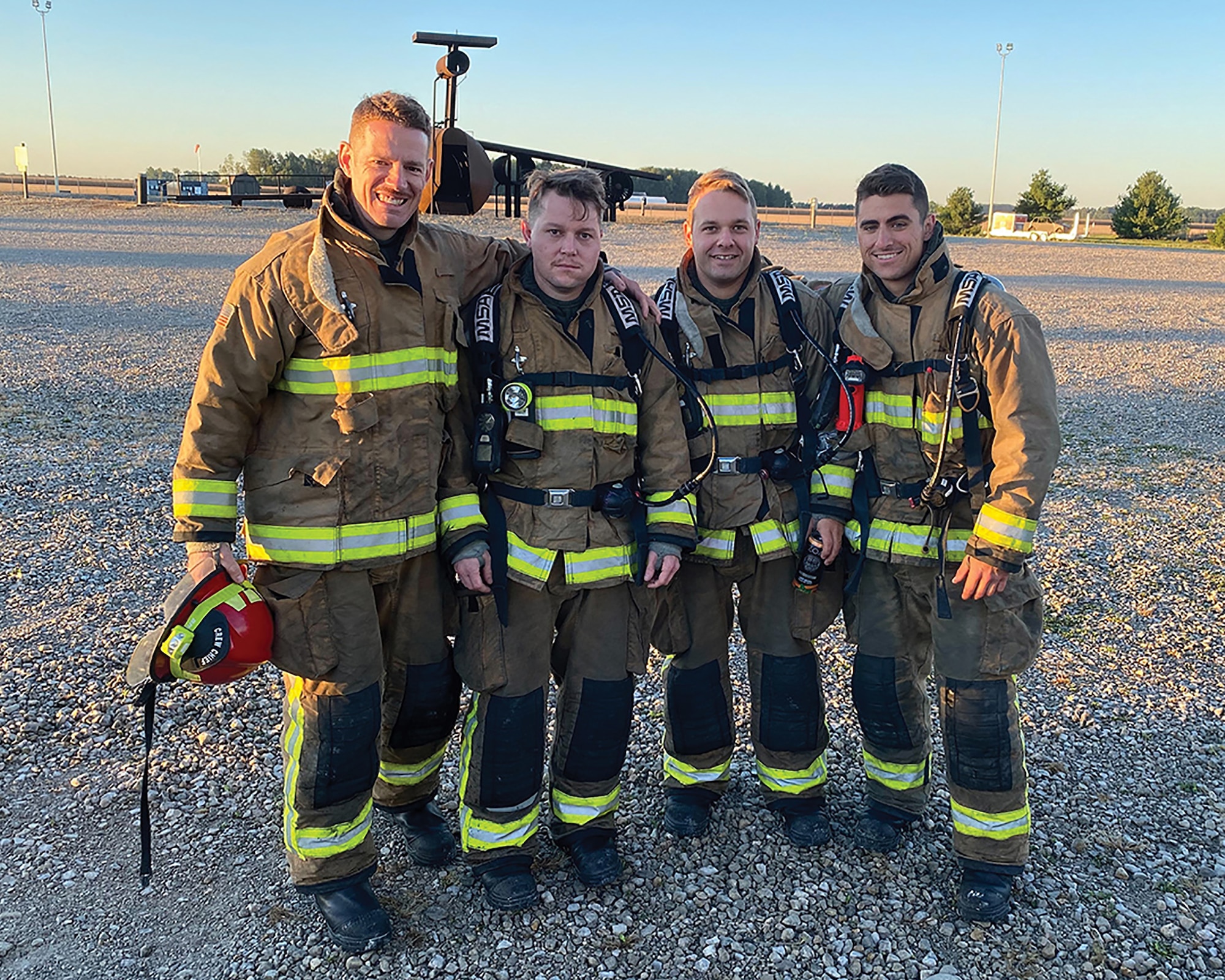 left to right) Tech. Sgts. Zachariah Hastings and Brian Kutcher, and Staff Sgts. Matthew Archer and Thomas Drouillard, 445th Civil Engineer Squadron firefighters, pose for a photo during the Department of Defense firefighter, rescue and survival course at Grissom Air Reserve Base, Indiana, Sept. 20-24, 2021. The one-week course is held twice annually and incorporates many elements of training otherwise covered in shorter sessions. At course culmination, the nine students worked in smaller teams to rotate through a live fire simulation, rescuing a downed firefighter from the building.