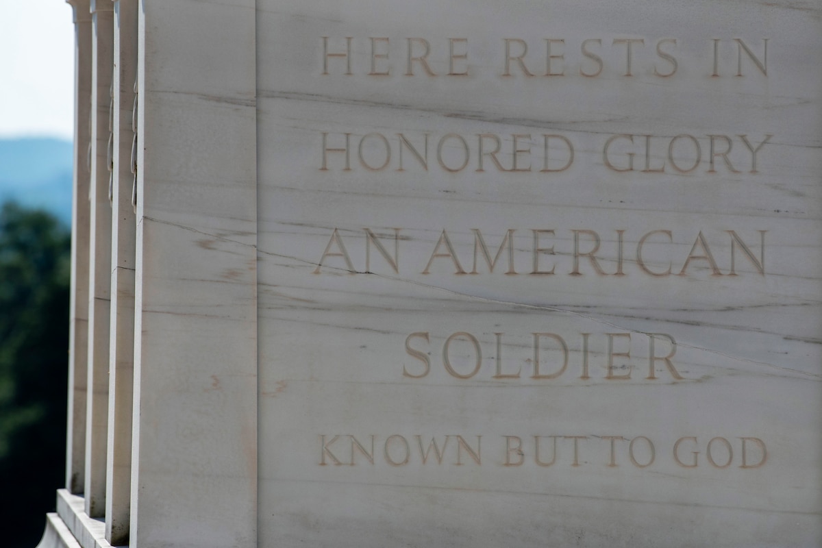 Marble tomb with words engraved: Here Rests in Honored Glory an American Soldier Known but to God."