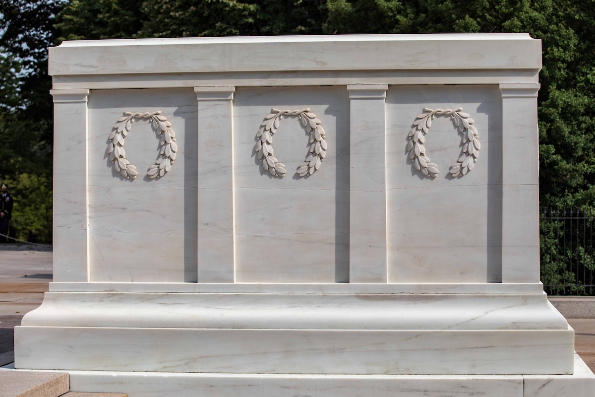 Three wreaths on a tomb.