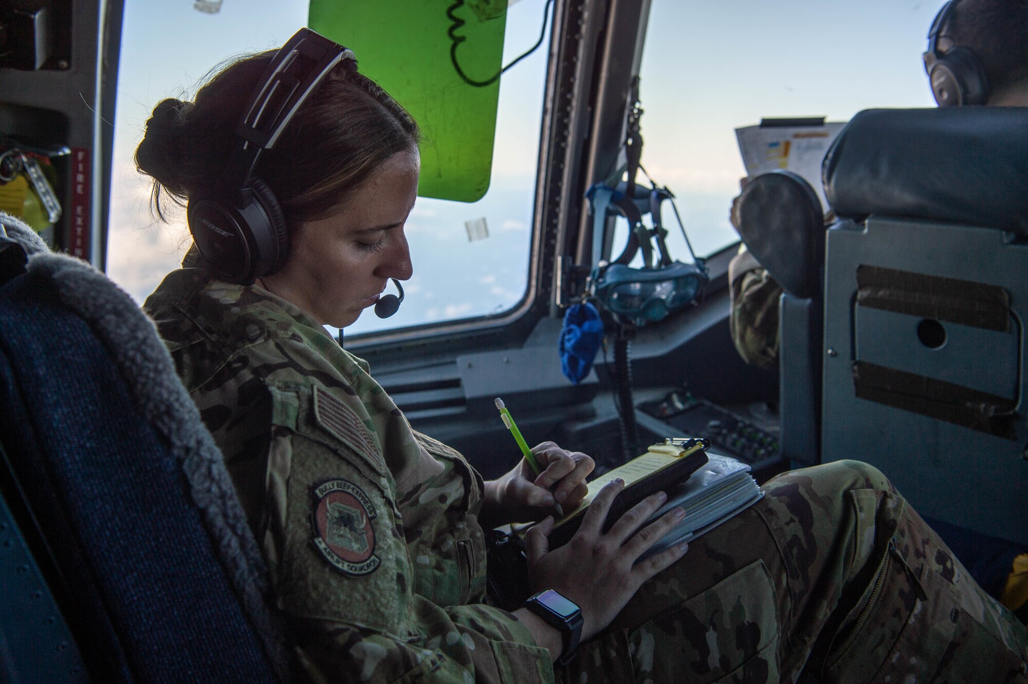 Capt. Sarah Radakovich, 6th Airlift Squadron C-17 pilot, annotates training occurrences during the 535th Airlift Squadron’s quarterly training around the Hawaiian Islands, Nov. 3, 2021. Radakovich was one of four Airmen assigned to Joint Base McGuire-Dix Lakehurst, New Jersey, that supported flight operations during the training. (U.S. Air Force photos by Senior Airman Alan Ricker)