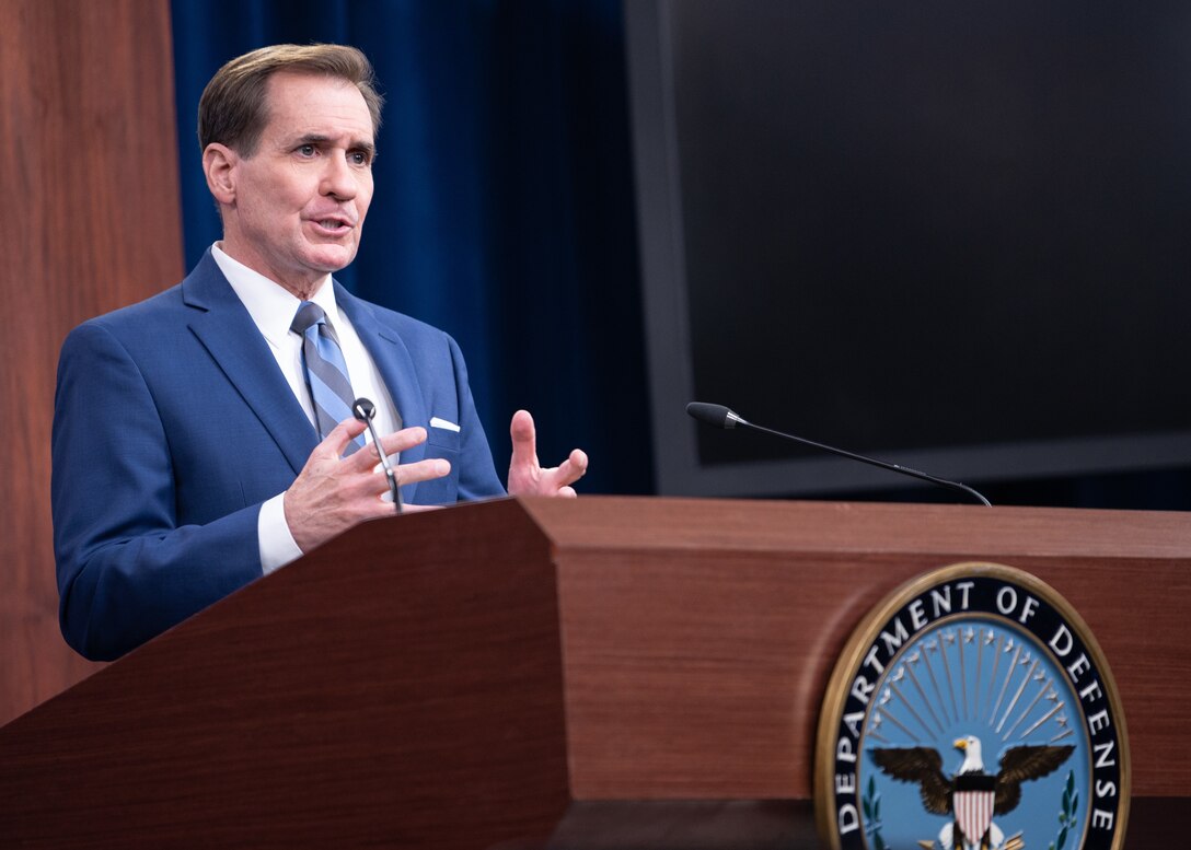 A man speaks at a podium.