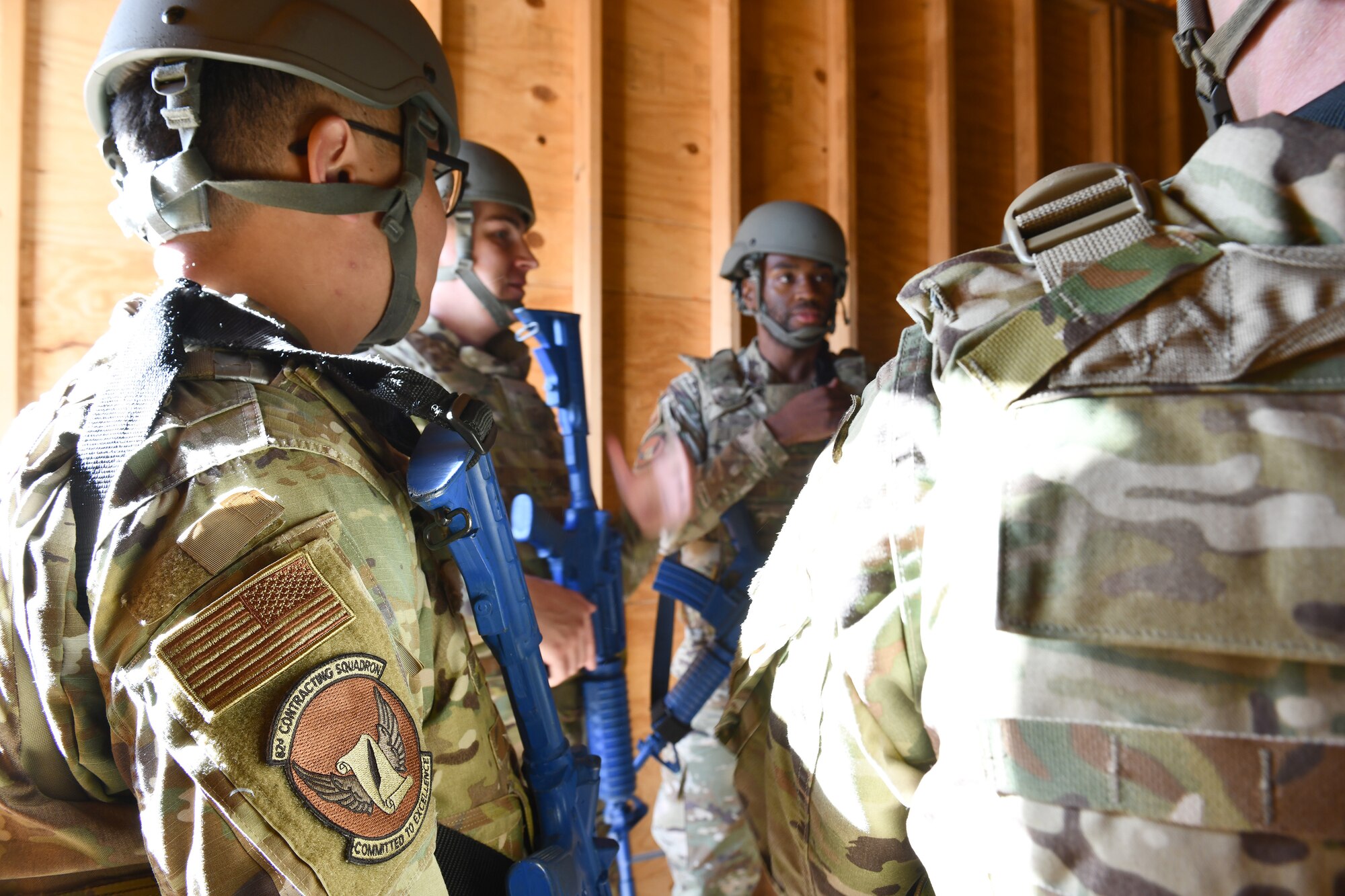 A group of contracting Airmen prepare to conduct simulated contract negotiations.