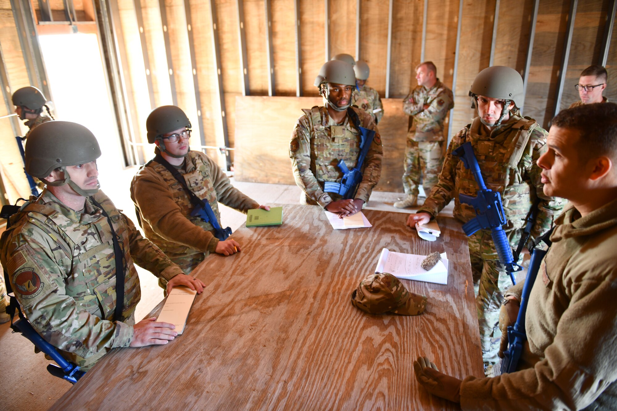 Group of Airmen practice contract negotiations.