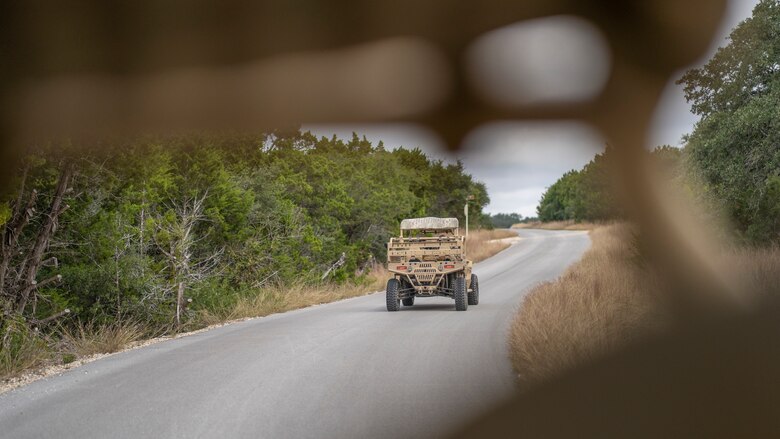U.S. Air Force Maj. Gen. Michele Edmondson, drives a MRZR 4, an ultralight all-terrain vehicle, during a visit to the 353rd Special Warfare Training Squadron to observe Tactical Air Control Party student training, and tour facilities at Joint Base San Antonio-Camp Bullis, Nov. 2, 2021.