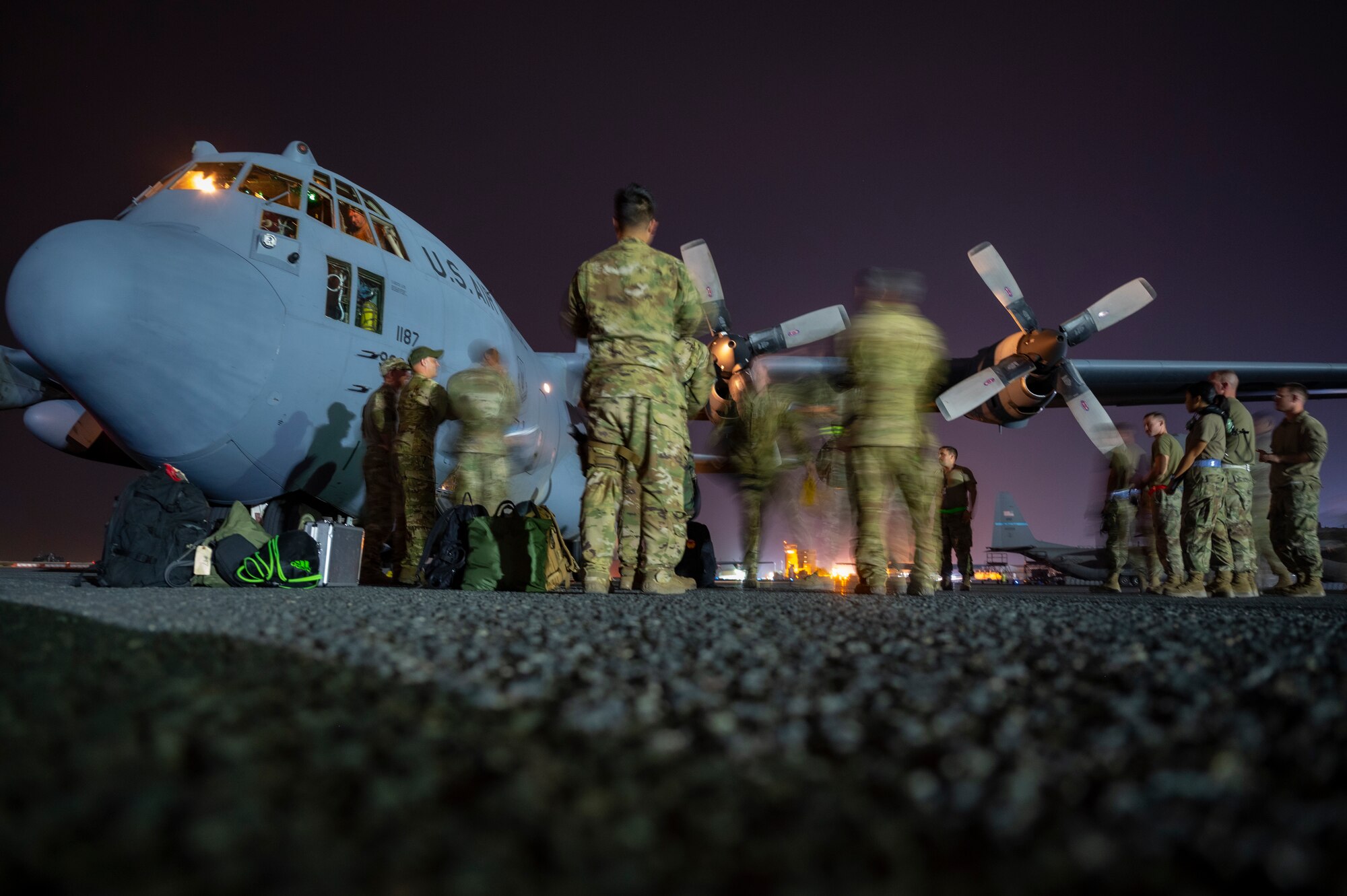 Members from the 779th Expeditionary Airlift Squadron depart a C-130H Hercules at Ali Al Salem Air Base, Kuwait, Nov. 2, 2021.