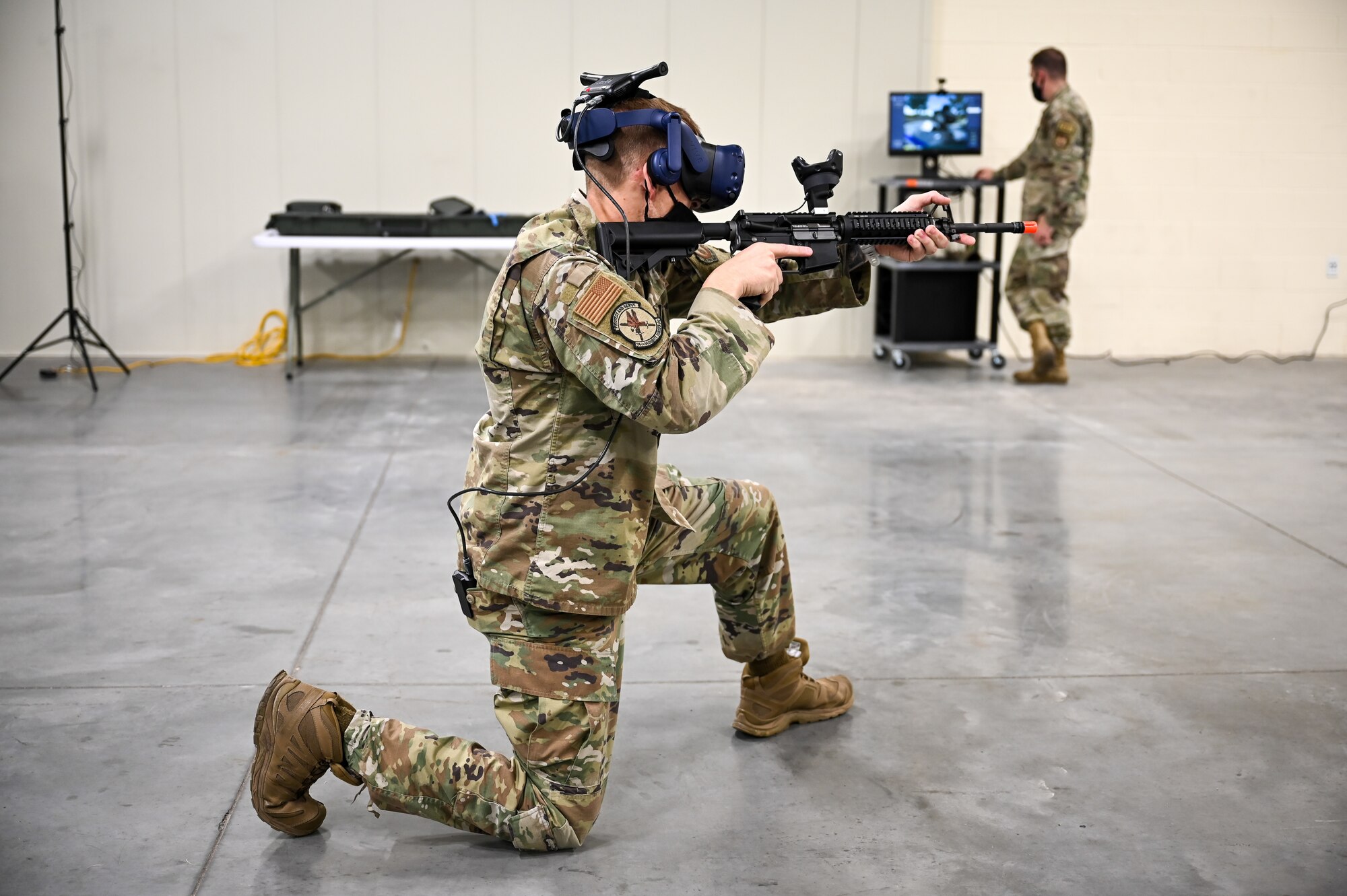 Tech. Sgt. Andrew Schnacker, 75th Security Forces Squadron, during a use-of-force response scenario with the Street Smarts Virtual Reality system. The squadron recently implemented virtual reality to fully immerse themselves into realistic three-dimensional situations to enhance their training. (U.S. Air Force photo by Cynthia Griggs)