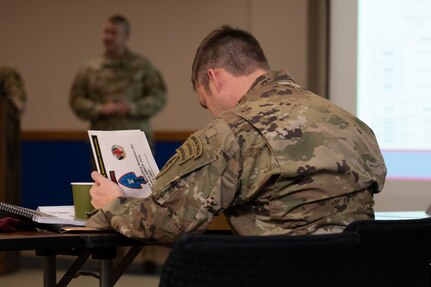 Members from various service components listen on during a briefing at the 2021 Special Operations Forces Training "Shura" hosted by the Special Warfare Training Wing.