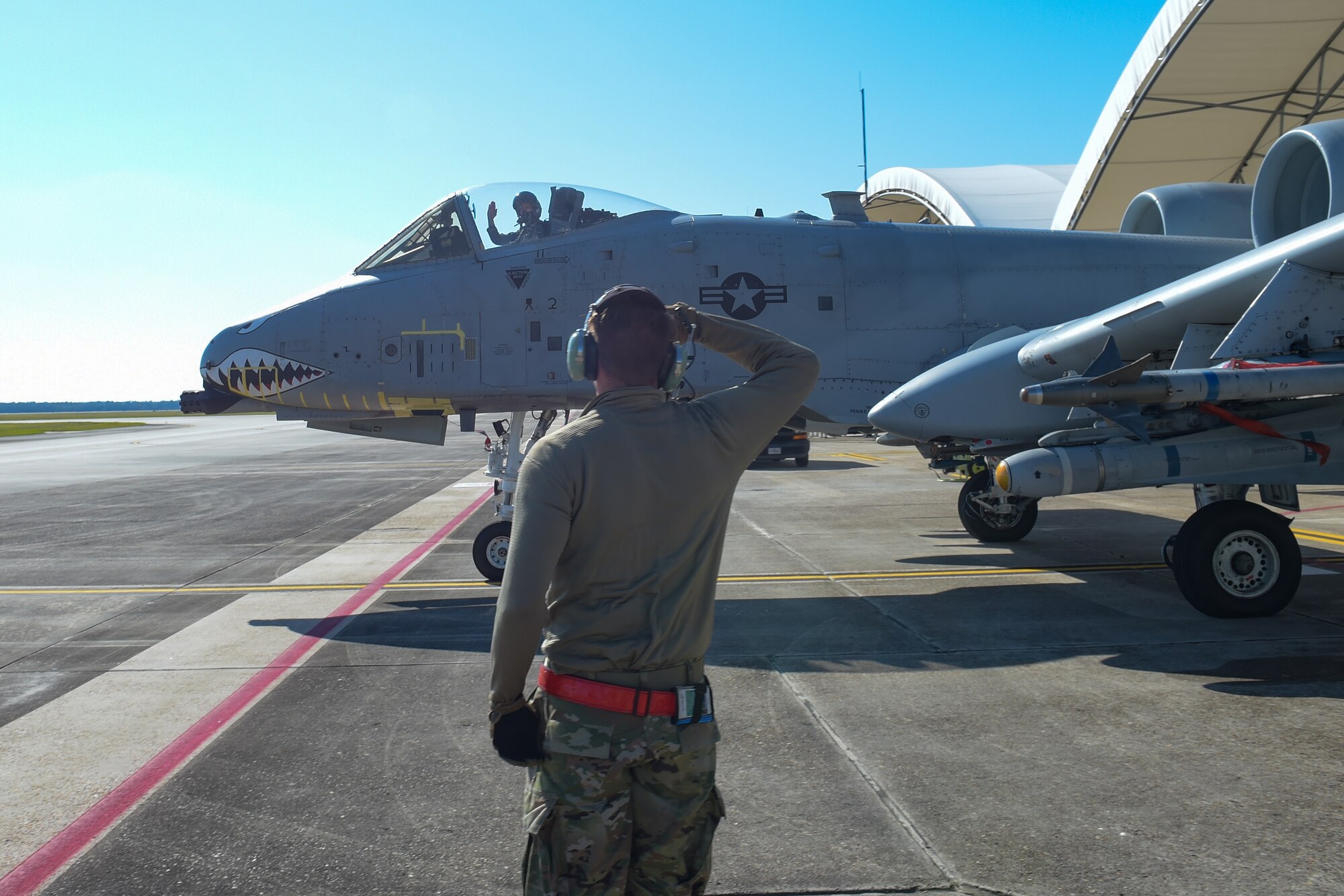 A photo of an Airman saluting.