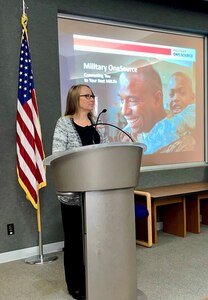 Kimberly Goodin, the Indiana state consultant for Military OneSource, briefs Airmen on available Military OneSource benefits, November 6, 2021 at Grissom Air Reserve Base, Indiana. Goodin attended the November unit training assembly to educate members about the resources and benefits the program has for all service members and their families.