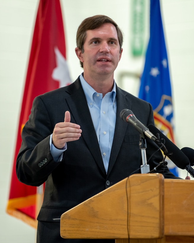 Kentucky Gov. Andy Beshear speaks to audience members during a ceremony at the Kentucky Air National Guard Base in Louisville, Ky., Nov. 6, 2021, to welcome the arrival of two new C-130J Super Hercules aircraft. The state-of-the-art transports are among eight that the 123rd Airlift Wing will receive over the next 11 months to replace eight aging C-130 H-model aircraft, which entered service in 1992 and have seen duty all over the world. (U.S. Air National Guard photo by Dale Greer)