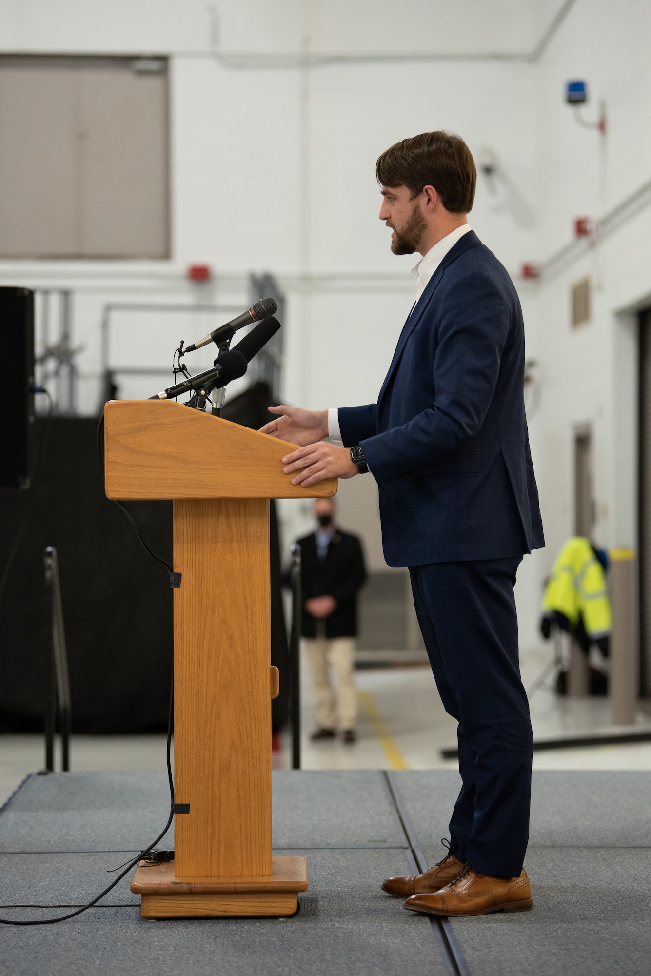 Hunt VanderToll, legislative director for Congressman Andy Barr, speaks to audience members during a ceremony at the Kentucky Air National Guard Base in Louisville, Ky., Nov. 6, 2021, to welcome the arrival of two new C-130J Super Hercules aircraft. The state-of-the-art transports are among eight that the 123rd Airlift Wing will receive over the next 11 months to replace eight aging C-130 H-model aircraft, which entered service in 1992 and have seen duty all over the world. (U.S. Air National Guard photo by Dale Greer)