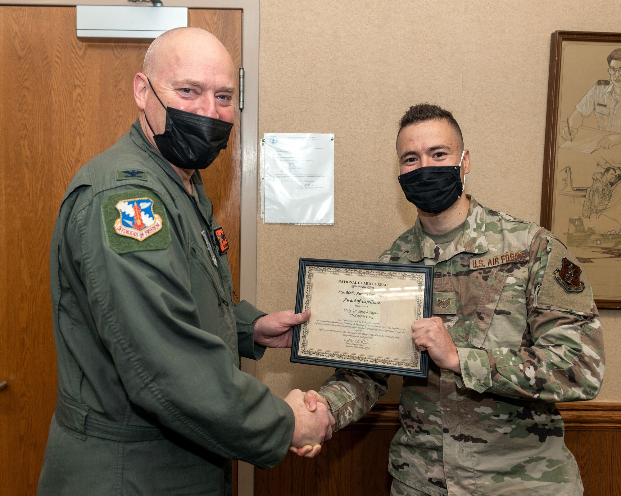 Airman receiving award.