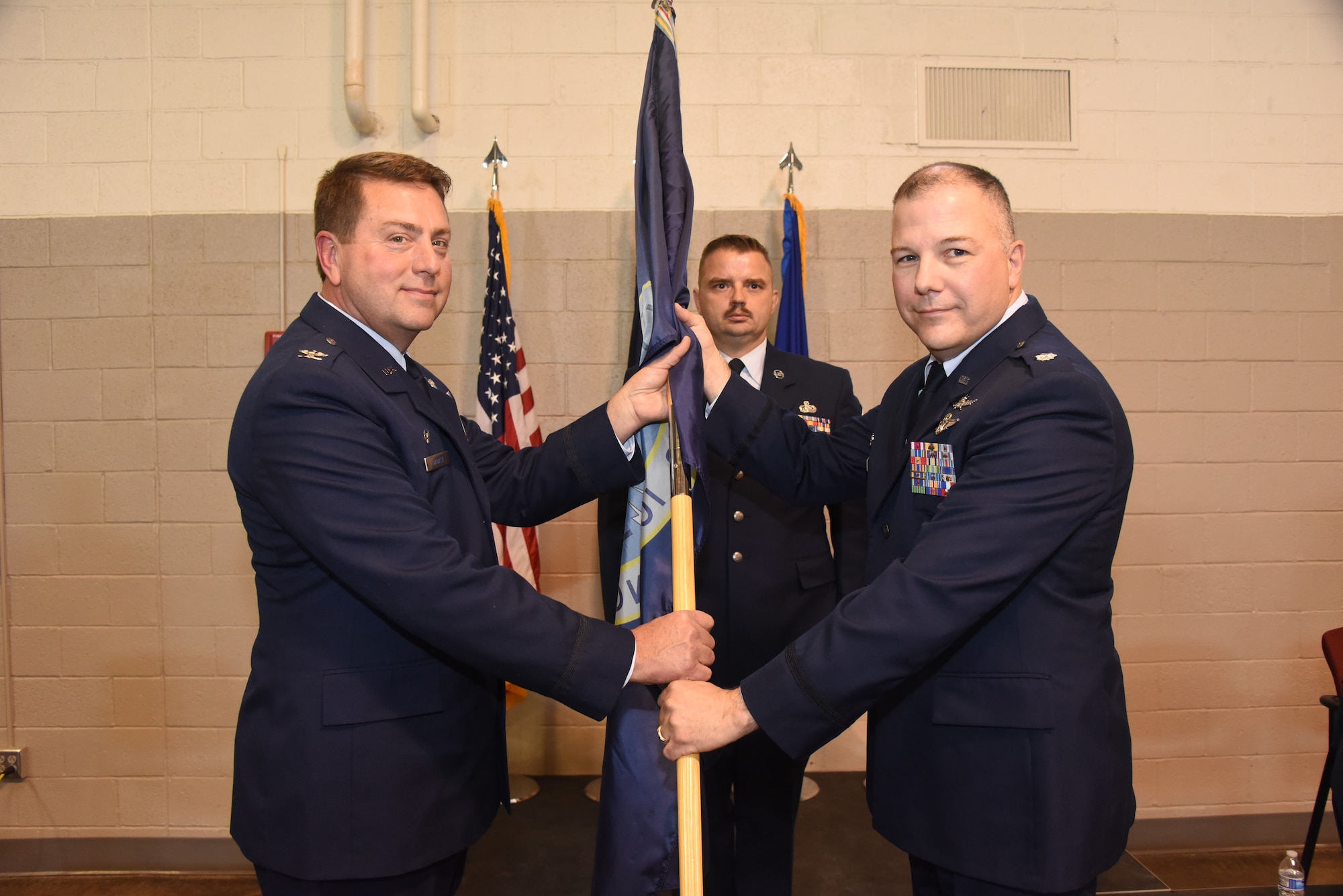 Lt. Col. Jason Kolacia accepts guidon from Col. Mark Muckey, Commander of the 185th Air Refueling Wing