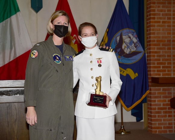 Capt. Beth Regoli, left, joins Lt. j.g. Suzelle Thomas following Thomas’ naval aviator winging ceremony.