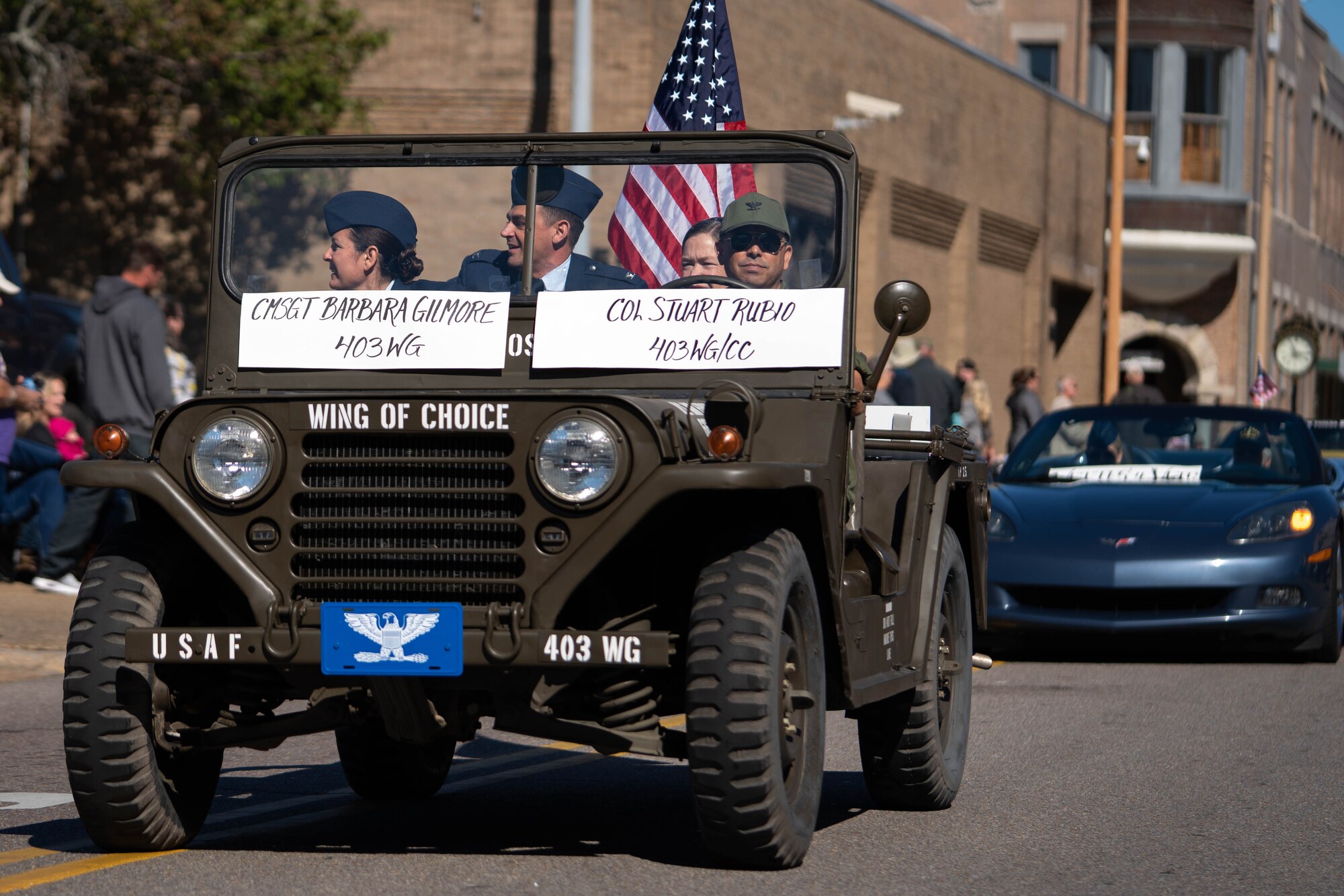 Vietnam era jeep with three members of the 403rd wing