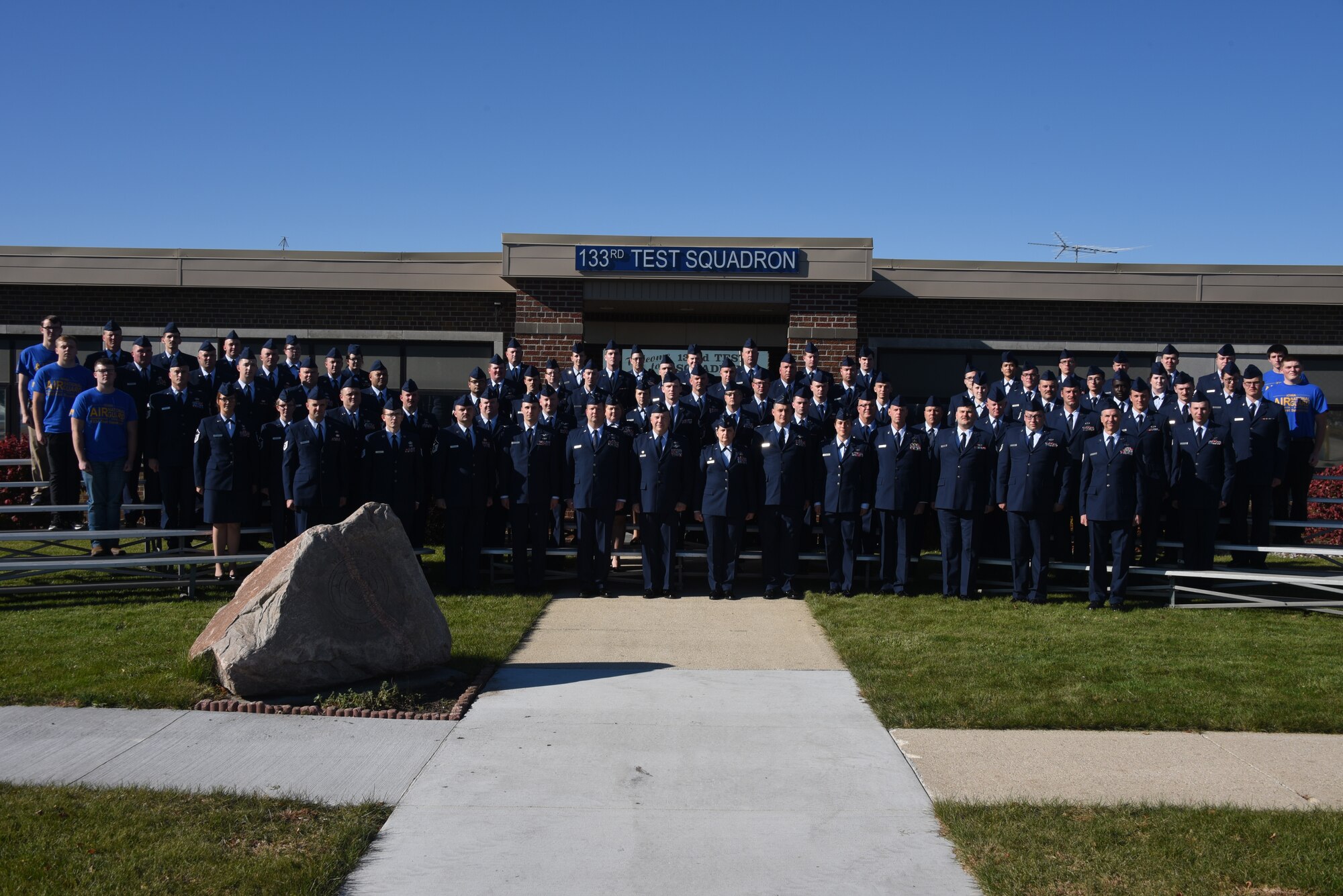 Airmen of the 133rd Test Squadron pose for a photo