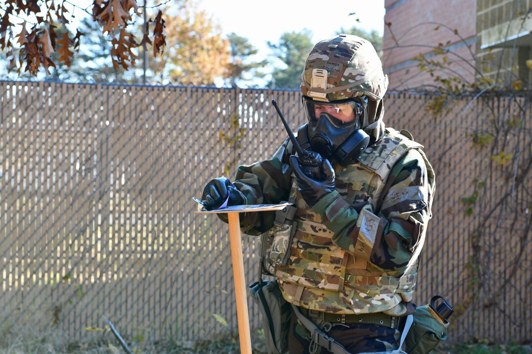 Senior Airman Zachary MacIntosh, a communications specialist with the 104th Communications Flight, inspects M8 paper while doing a post-attack reconaissance sweep during a midpoint inspection readiness exercise November 6, 2021 at Barnes Air National Guard Base, Massachusetts. Midpoint inspections are conducted to evaluate the wing’s capabilities to respond to threats in a contested, degraded, and operationally limited environment. (U.S. Air National Guard photo by Staff Sgt. Hanna Smith)
