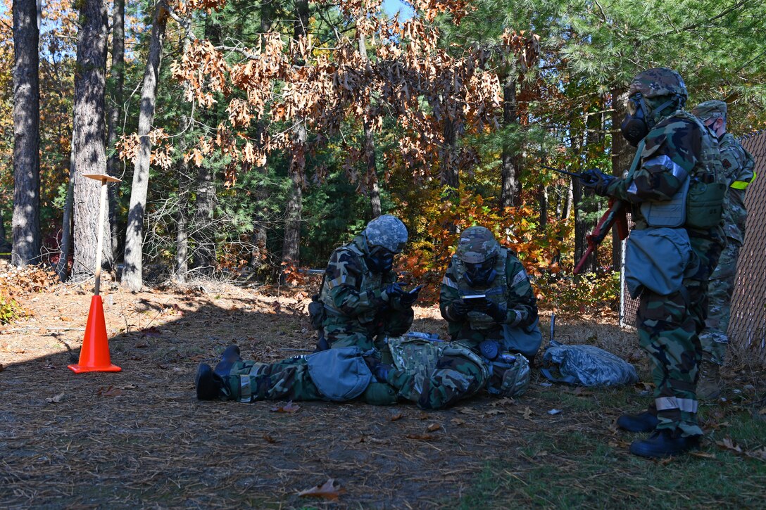 104th Communications Flight Airmen respond to an exercise scenario while on a Post-Attack Reconaissance team sweep during a midpoint inspection readiness exercise November 6, 2021 at Barnes Air National Guard Base, Massachusetts. Midpoint inspections are conducted to evaluate the wing’s capabilities to respond to threats in a contested, degraded, and operationally limited environment. (U.S. Air National Guard photo by Staff Sgt. Hanna Smith)