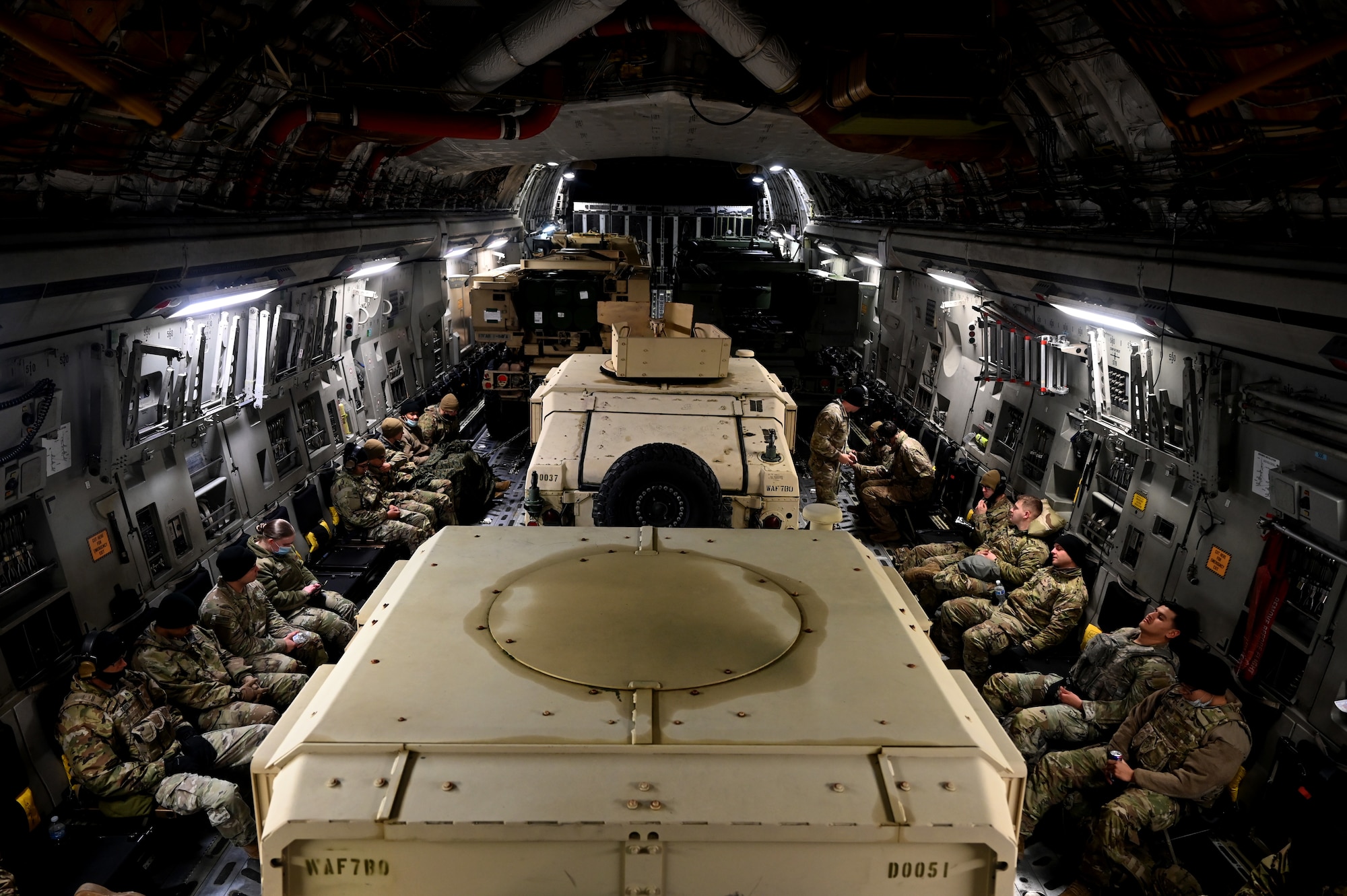 U.S. Army Soldiers with Bravo Battery, 194th Field Artillery Regiment, 17th Field Artillery Brigade prepare for take off on a C-17 Globemaster III during Exercise Rainier War 21B at Joint Base Lewis-McChord, Washington, Nov. 6, 2021. The exercise is designed to demonstrate the wing’s ability to operate and survive while defeating challenges to the U.S. military advantage in all operating domains – air, land, sea and cyberspace. (U.S. Air Force photo by Master Sgt. Julius Delos Reyes)