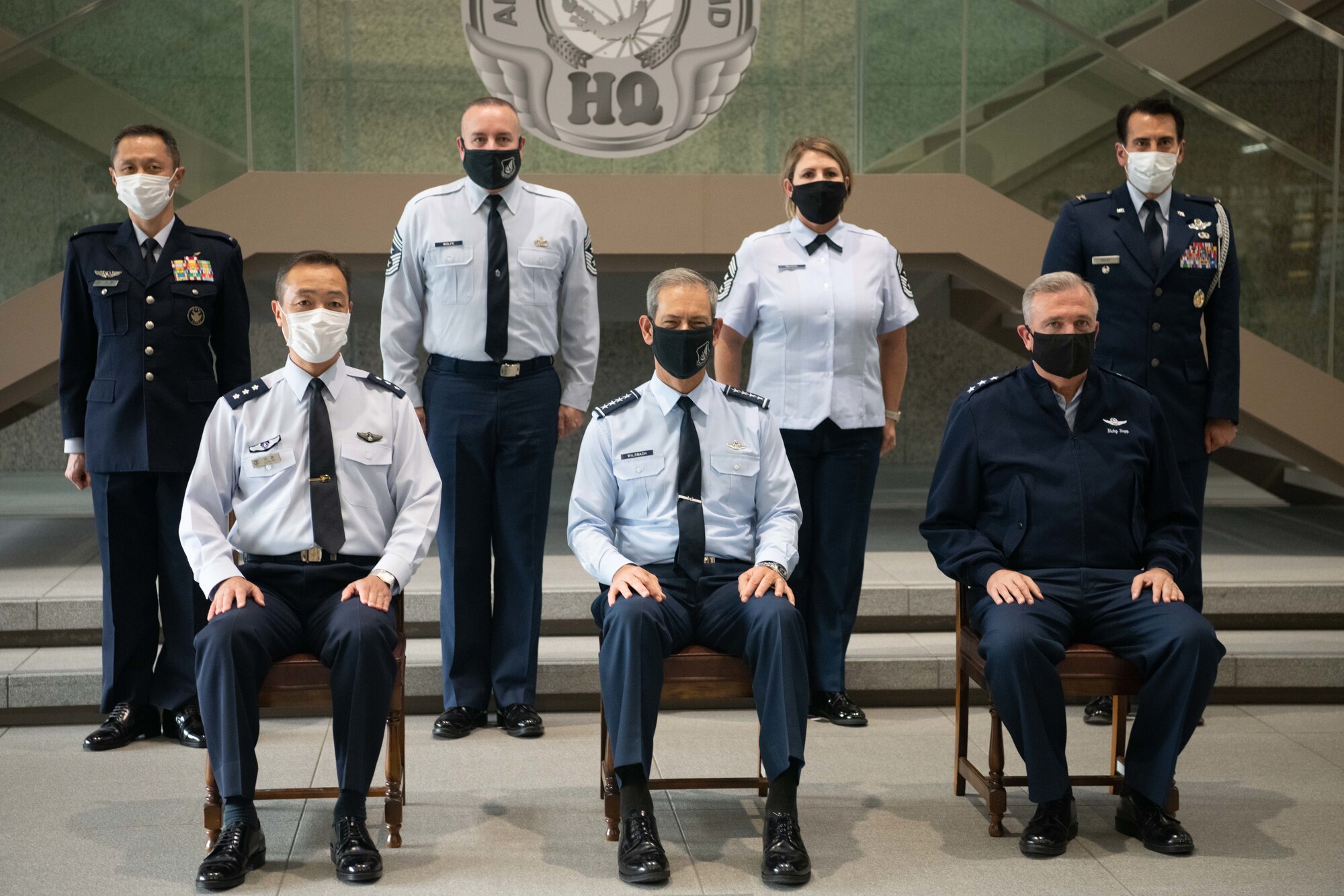 U.S. Air Force Gen. Ken Wilsbach, Pacific Air Forces commander, front-center, takes part in a group photo with Lt. Gen. Hiroaki Uchikura, Japanese Air Self-Defense Force, Air Defense Command commander, front-left, and Lt. Gen. Ricky Rupp, U.S. Forces Japan and 5th Air Force commander, front-right, and other officials as part of an annual site tour of U.S. Air Force and allied commands at the Japan Ministry of Defense