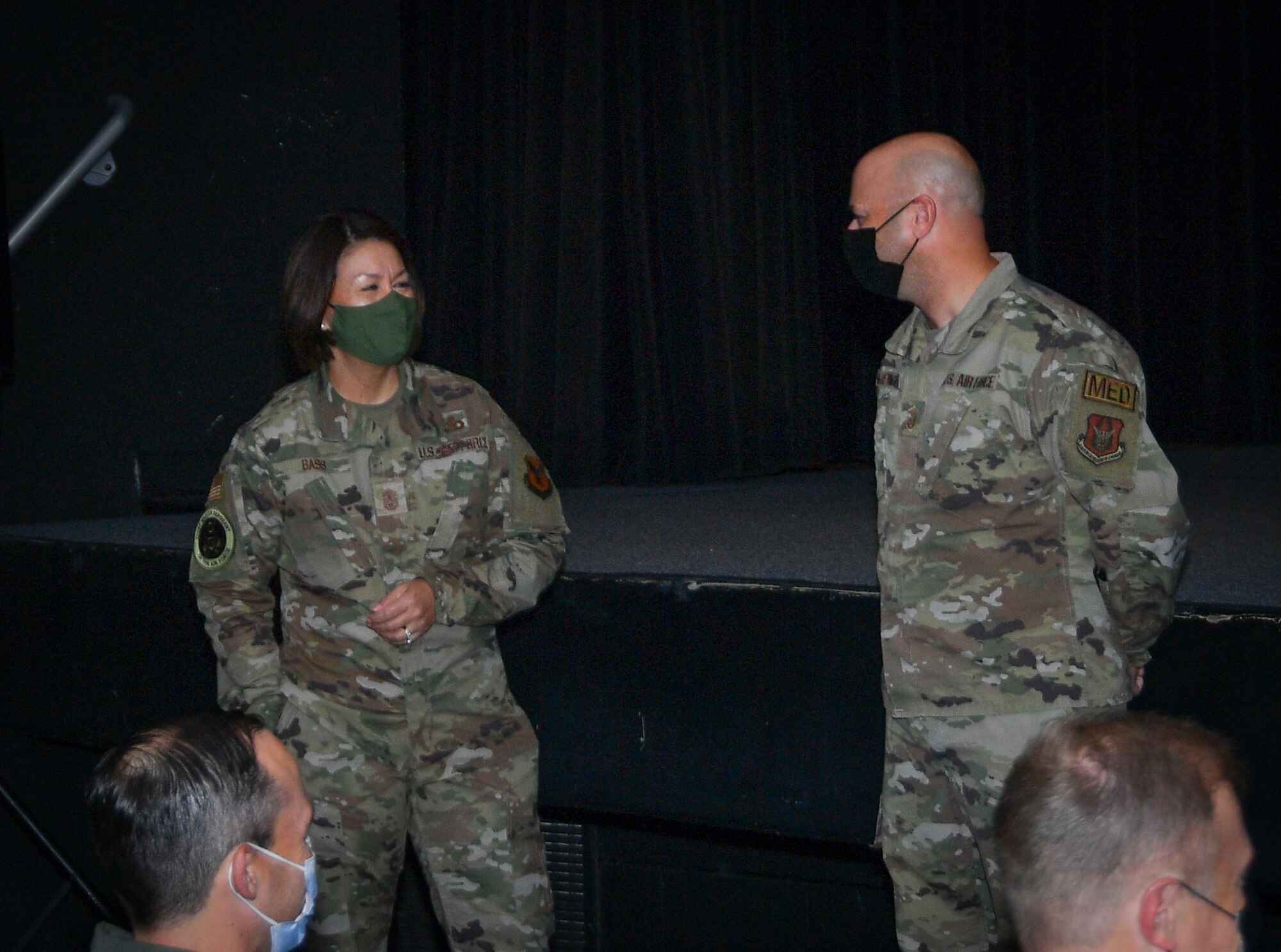 (left) Chief Master Sgt. of the Air Force JoAnne S. Bass speaks with Senior Master Sgt. Nate McReynolds, 301 FW Yellow Ribbon Program Office event manager during the All-Call event at Naval Air Station Joint Reserve Base Fort Worth, Texas, Nov. 6, 2021. Bass recognized McReynolds for excellence in being selected to serve the Yellow Ribbon Program at the Air Force Reserve Command level. (U.S. Air Force photo by Master Sgt. Jeremy Roman)