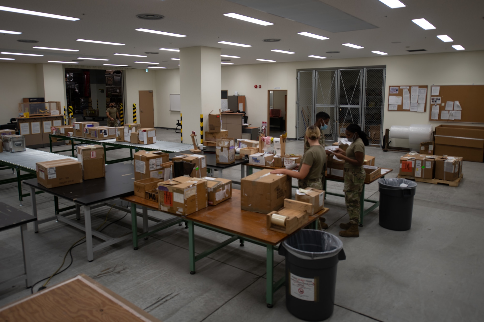 3 Airman package boxes and organize them in their wide packaging area