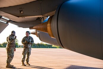 Airmen from the 100th Aircraft Maintenance Squadron speak at RAF Fairford, England, Nov.1, 2021. Airmen from the 100th Air Refueling Wing conducted operations out of RAFF as part of an Agile Combat Employment exercise. ACE enables U.S. forces in Europe to operate from locations with varying levels of capacity and support. This further ensures Airmen and aircrews are postured to deliver lethal combat power across the full spectrum of military operations. (U.S. Air Force photo by Senior Airman Eugene Oliver)