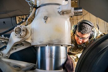 Staff Sgt. Alejandro Flores, 100th Aircraft Maintenance Squadron flying crew chief, inspects the landing gear of a KC-135 Stratotanker at RAF Fairford, England, Nov. 1, 2021. Airmen from the 100th Air Refueling Wing conducted operations out of RAFF as part of an Agile Combat Employment exercise. ACE enables U.S. forces in Europe to operate from locations with varying levels of capacity and support. This further ensures Airmen and aircrews are postured to deliver lethal combat power across the full spectrum of military operations. (U.S. Air Force photo by Senior Airman Eugene Oliver)