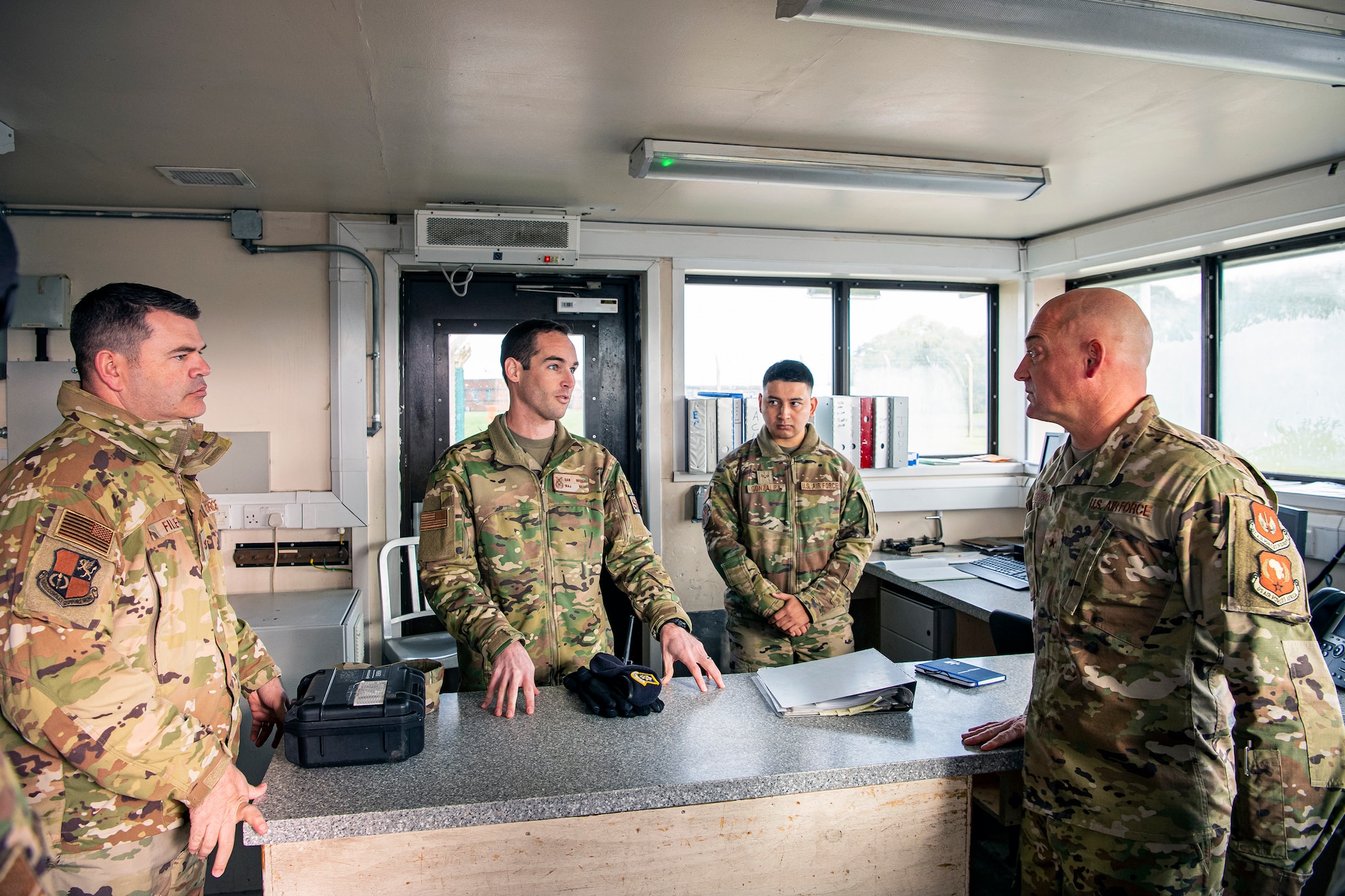 U.S. Air Force Maj. Daniel Merkh, center left, 423rd Security Forces Squadron commander, speaks with Brig. Gen. George T. Dietrich III, U.S. Air Forces in Europe - Air Forces Africa director of logistics, engineering and force protection, at RAF Molesworth, England, Nov. 3, 2021.  Dietrich visited with Airmen from five geographically separated units across the wing and learned more about the unique mission of the 501st CSW. (U.S. Air Force photo by Senior Airman Eugene Oliver)