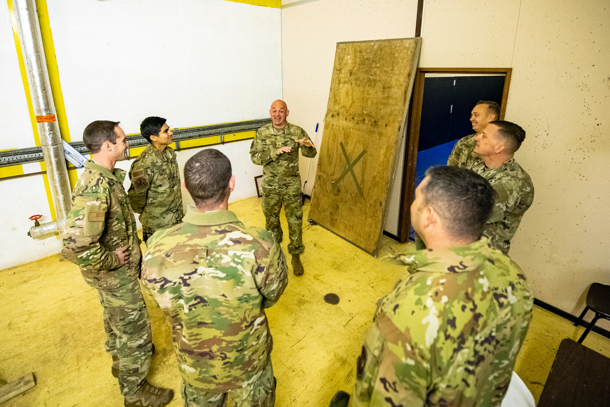 U.S. Air Force Brig. Gen. George T. Dietrich III, center, U.S. Air Forces in Europe - Air Forces Africa director of logistics, engineering and force protection, speaks with Airmen from the 501st Combat Support Wing at RAF Molesworth, England, Nov. 5, 2021. Dietrich visited with Airmen from five geographically separated units across the wing and learned more about the unique mission of the 501st CSW. (U.S. Air Force photo by Senior Airman Eugene Oliver)