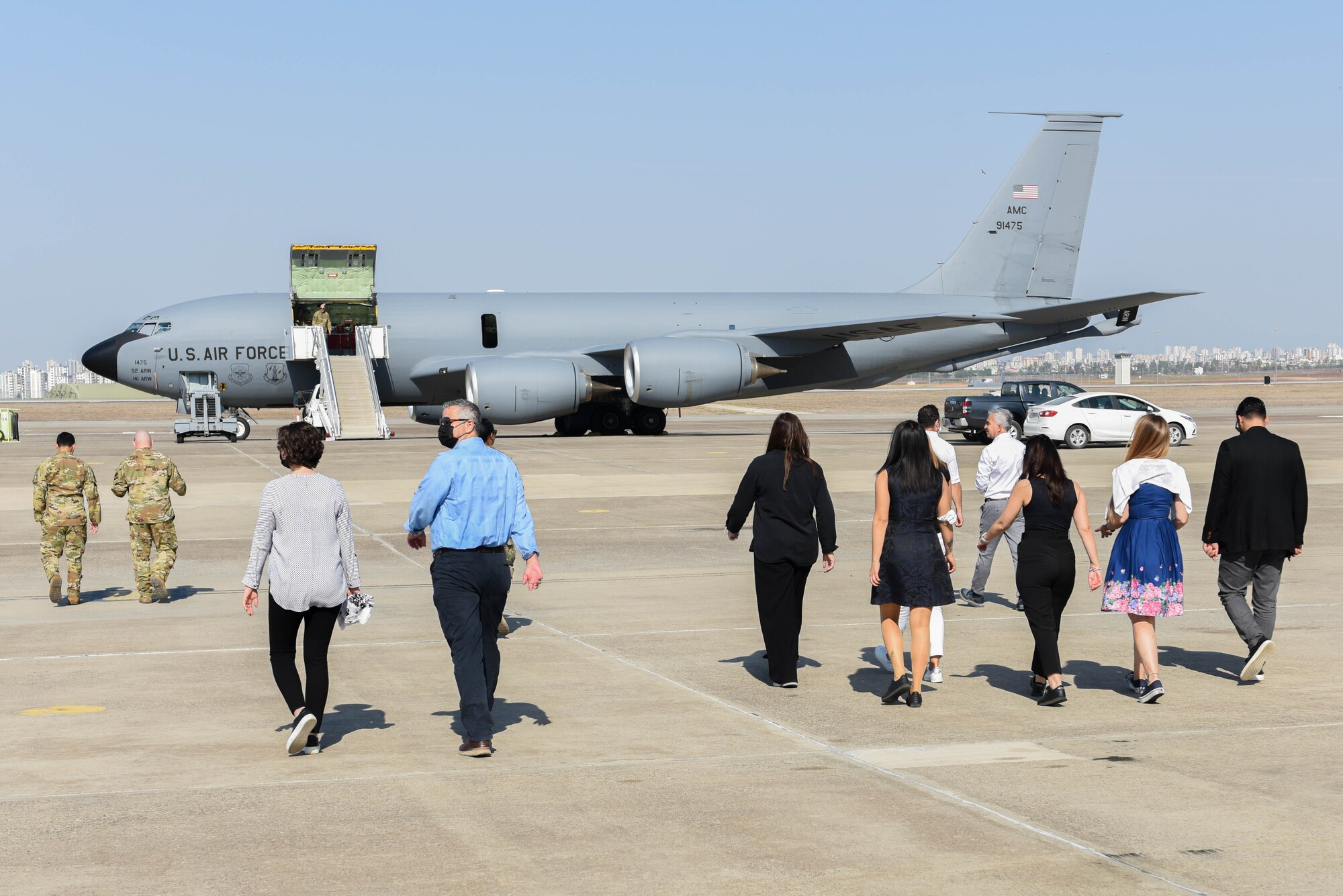 U.S. Air Force Airmen and Turkish medical professionals walk to KC-135 Stratotanker