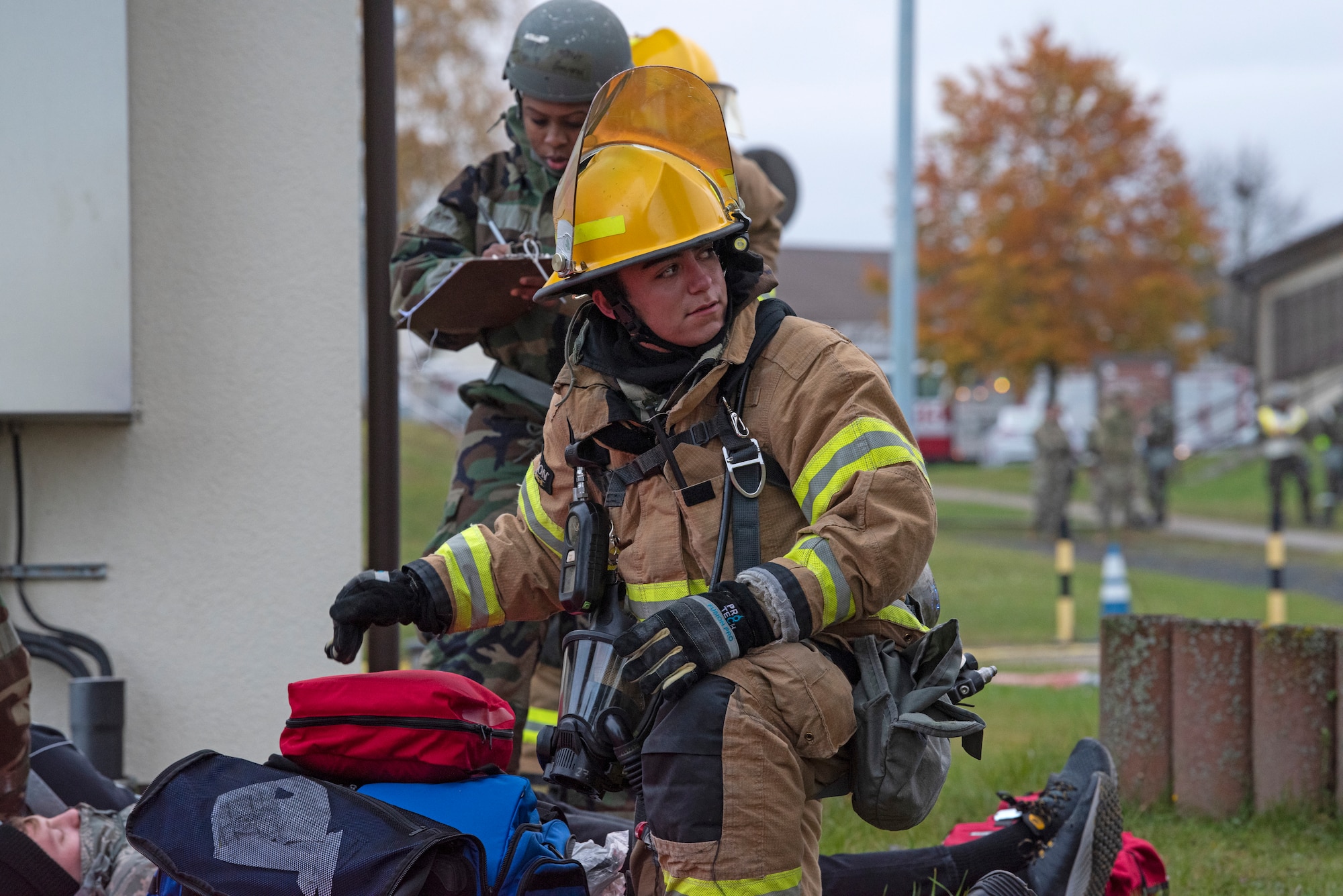 U.S. Air Force Airman 1st Class Christian Adamich, 52nd Civil Engineer Squadron Fire and Emergency Services flight firefighter, responds to a mass casualty simulation, Nov. 4, 2021, on Spangdahlem Air Base, Germany. The 52nd FES Airmen aided in response by extricating victims from a distressed building, transporting them to triage, and aiding medical personnel. (U.S. Air Force photo by Tech. Sgt. Anthony Plyler)